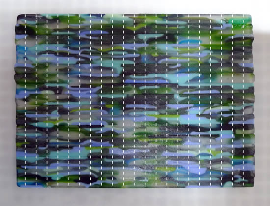 Re-cutting the fused glass slab.