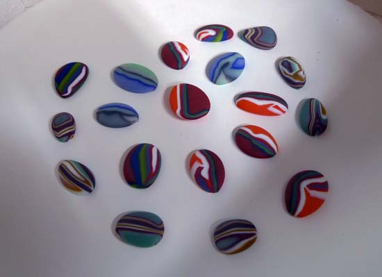 Fused glass cabochons ready to fire-polish.